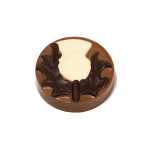 milk chocolate disc with dark and white chocolate thistle design