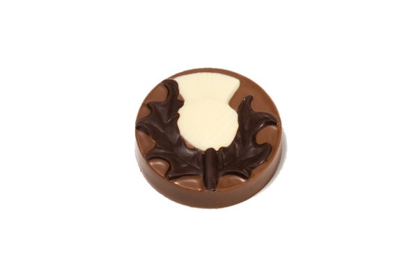 milk chocolate disc with dark and white chocolate thistle design