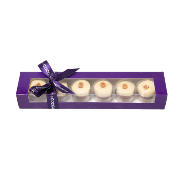 highland fudge cylinders in a purple box with ribbon