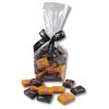 fruit salad and black chews in a cello bag with ribbon