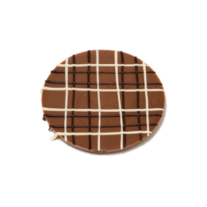 milk chocolate disc with coloured chocolate tartan pattern