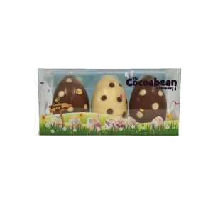 trio of milk and white chocolate easter eggs with dot pattern cocoabean