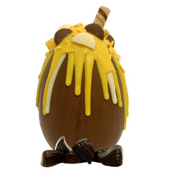 chocolate orange drippy easter egg with chocolate buttons and chocolate orange creams