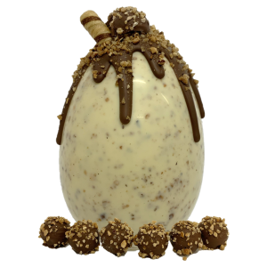 nut white chocolate easter egg with chocolate drips and hazelnut truffles