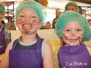 two children in a chocolate making workshop