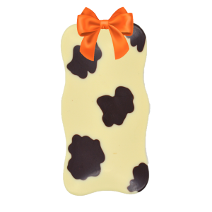 white and dark chocolate wavy cow bar with orange ribbon