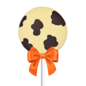 white and dark chocolate cow lollipop with orange bow